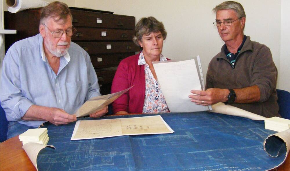 VOLUNTEERS: Waterworks Museum volunteers Cliff Giles, Julie Elliott and Mark Porter looking over old plans at the museum. 