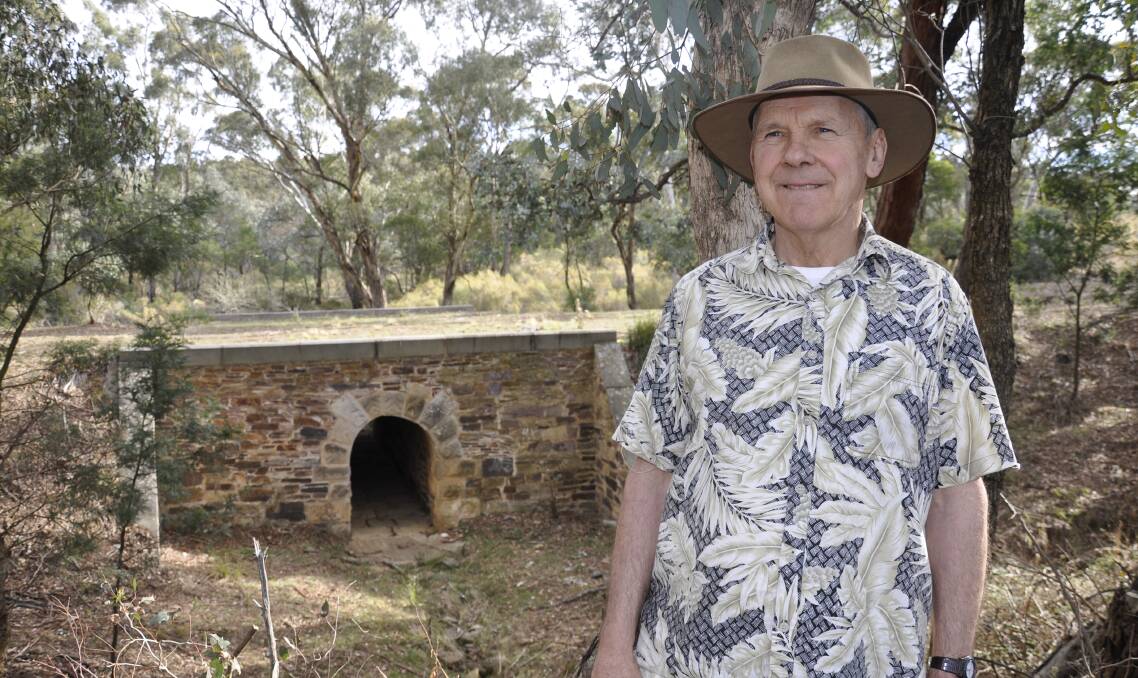 Historian Phil Leighton-Daly pictured at one of the convict-built culverts on the Great South Road near Towrang. Photo Louise Thrower