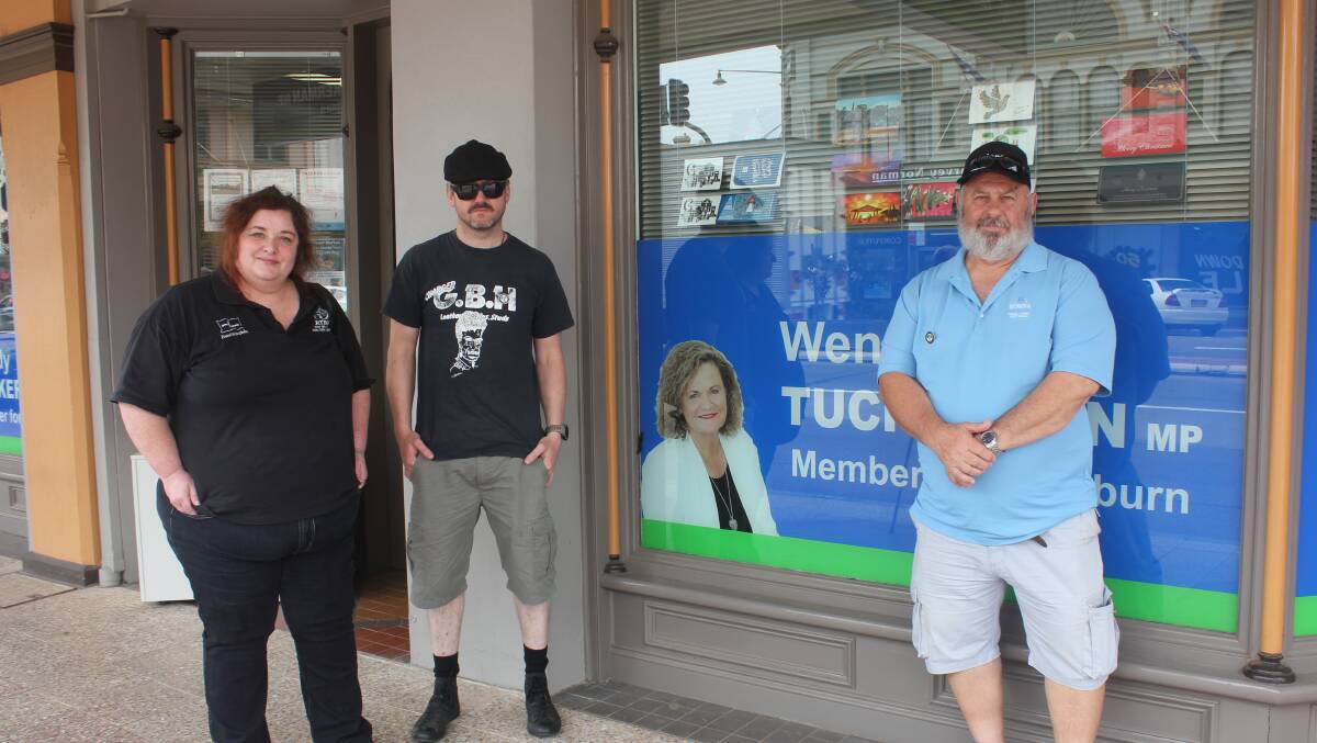 RTBU official Helen Bellette, with cleaners Dominic Kain and Garry Stevenson out the front of member for Goulburn Wendy Tuckerman's office on Friday. Photo David Cole.