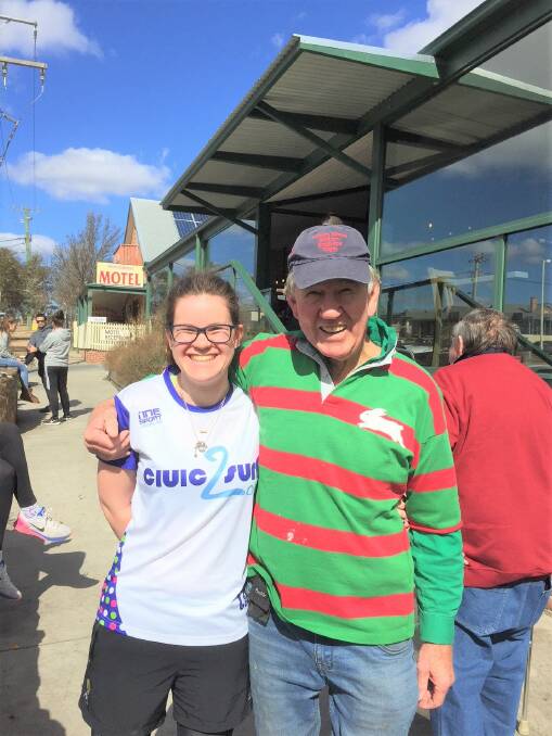 Civic2Surf sponsorship director Sarah Davoren met Trapper Keith Woodman when they stopped at Trapper's Bakery on Friday. He donated $50 to their cause. Photo David Cole.