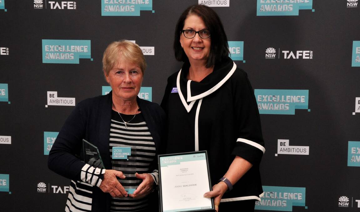HONOUR: Anne Walshaw receiving her TAFE Excellence Award recently from TAFE NSW Regional General Manager Kerry Penton.