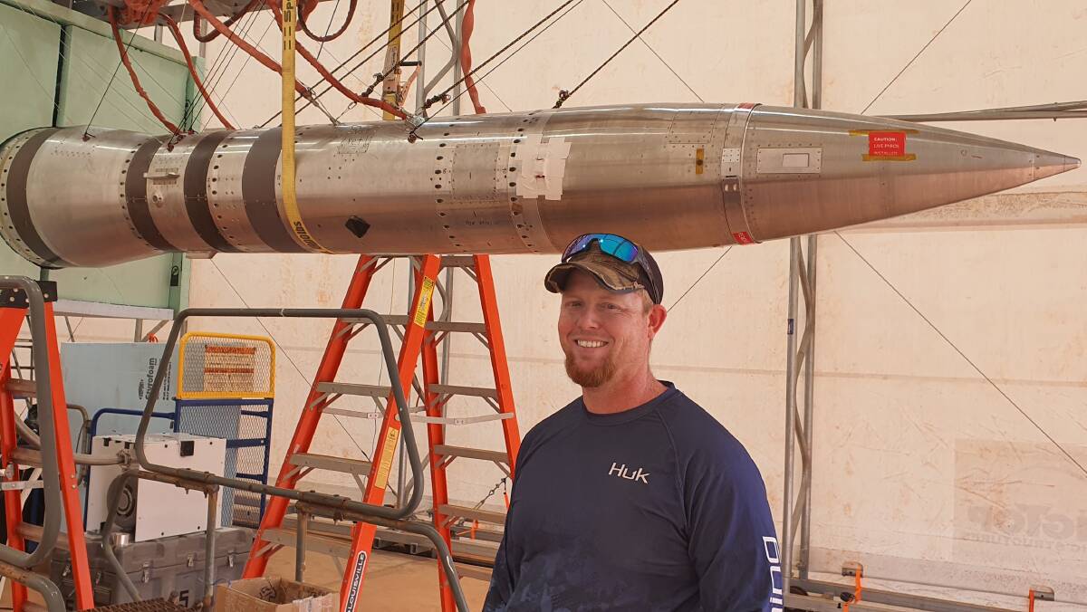 NASA Mission Manager Eric Roper with the DEUCE rocket at the Arnhem Space Centre prior to the launch. 