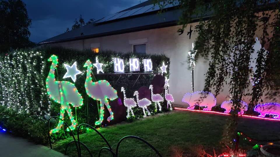 MERRY CHRISTMAS: Gae and Mark Watson welcome visitors to their Christmas wonderland in Crookwell. Photo: Facebook