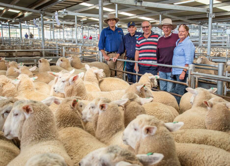 SELX: Saleyards manager Rick Maslin and George Hancock from Coopers Animal Health Australia, with Ken Haynes and Matt and Margaret Croker who sold 45 first-cross ewes for a top-price of $442 per head. Photo: SELX