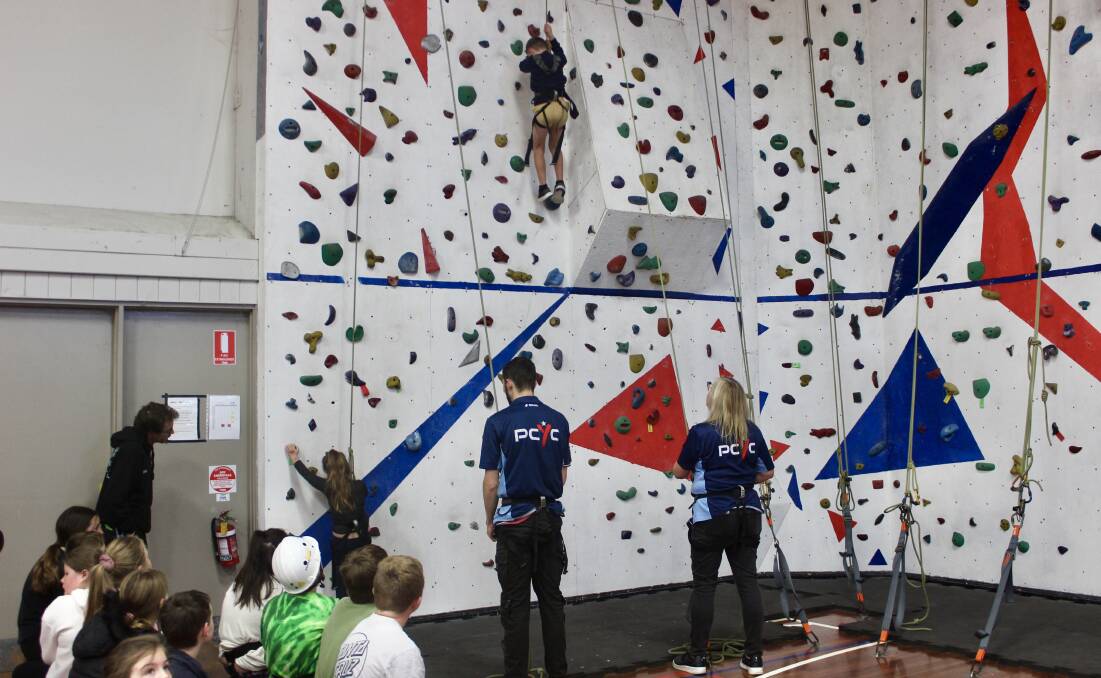 Climbing: Kids check out rock climbing as part of Active Fest. Picture: Sophie Bennett. 