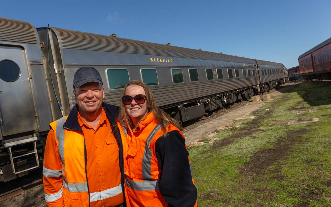 Simon Mitchell and Danielle Smith with some of their restored ex-Southern Aurora carriages that are now housed at Goulburn's historic Round House. 