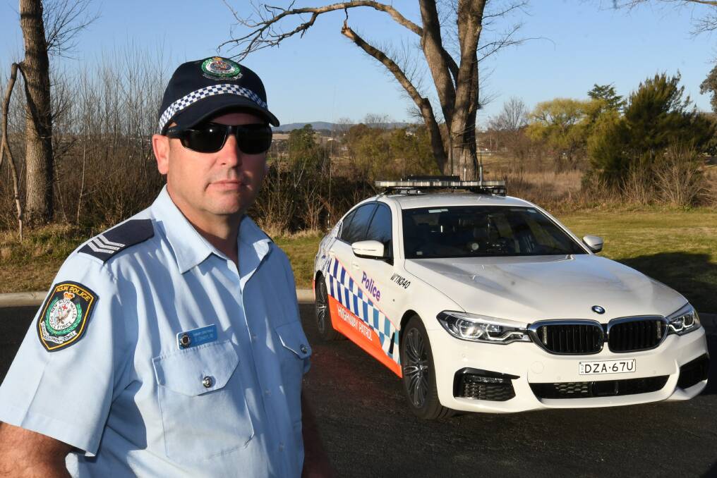 TOWARDS ZERO: Sergeant Steve Chaplin with one of the highway patrol vehicles which is equipped with the latest technology to help police reduce the road toll.