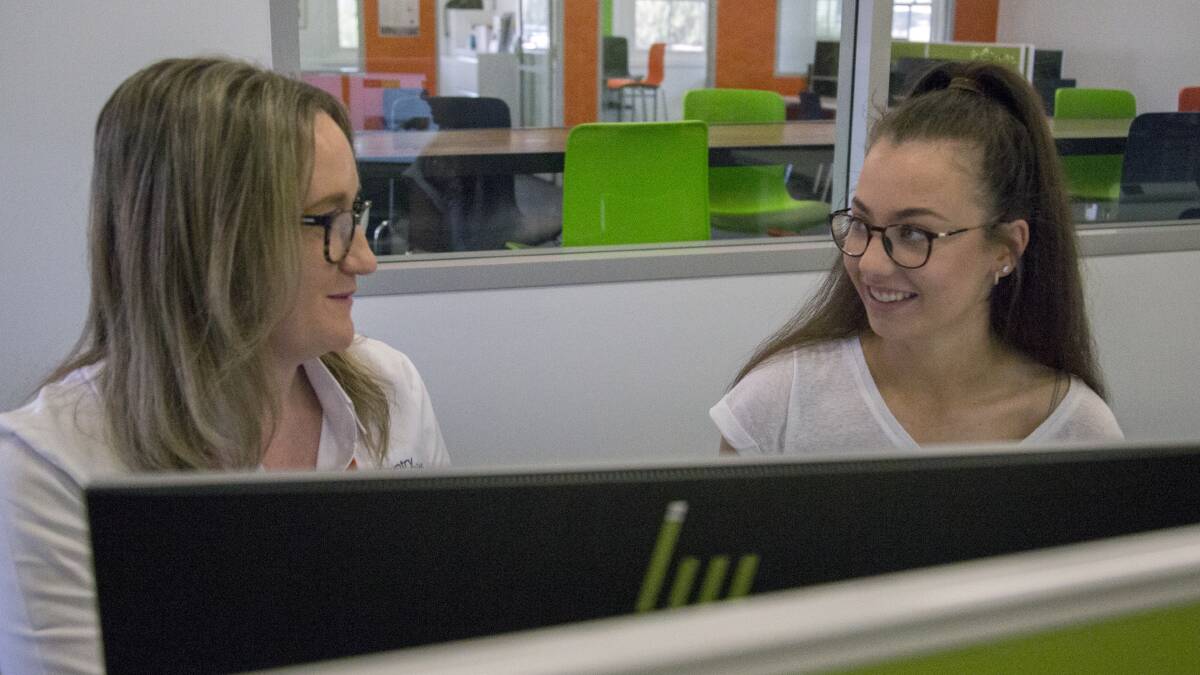 Entry options and ongoing support: Ash Jones, centre manager at CUC Goulburn, assists high school leaver, Ellie Patatoukos, in university enrolment. Photo: Supplied.