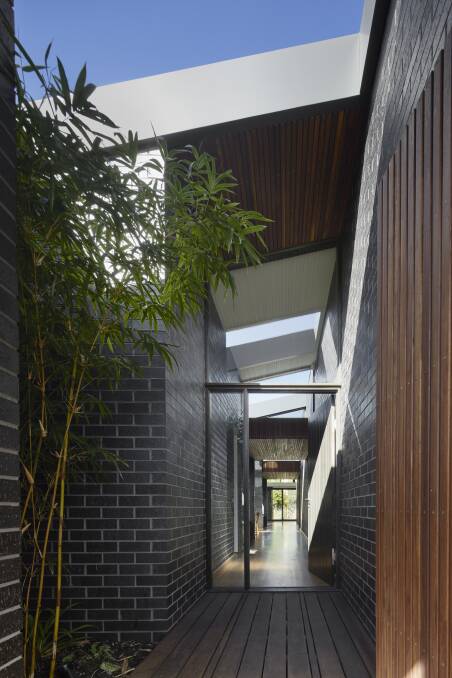 A secure front entry courtyard provides a layer of separation between the sanctuary of their home and the street.
