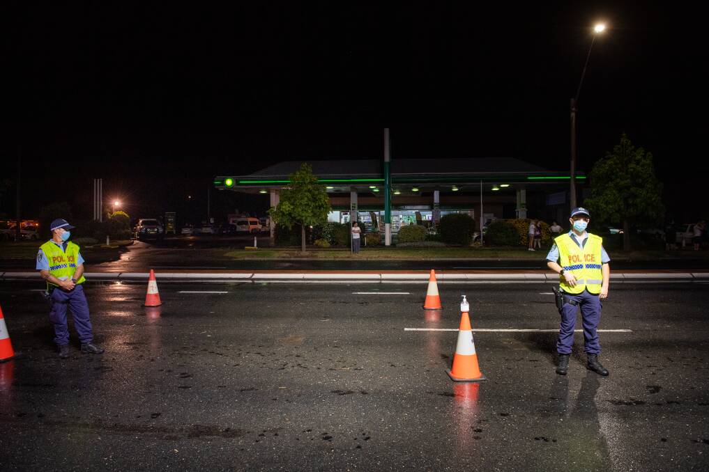 NSW Police on the final night of the state's border closure, on Wodonga Place. Picture: MARK JESSER