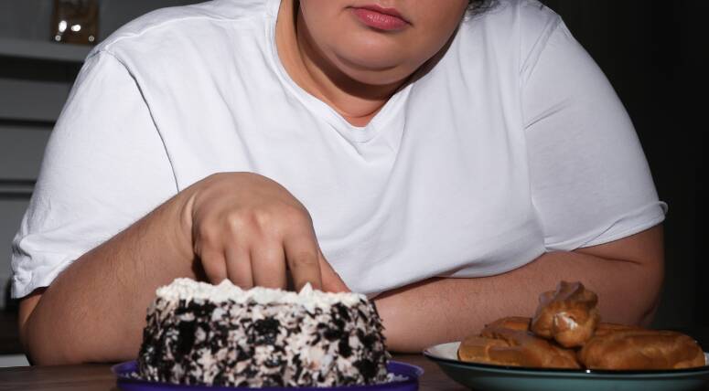 Eating foods high in sugar and fat is associated with sad or depressed mood. File picture.