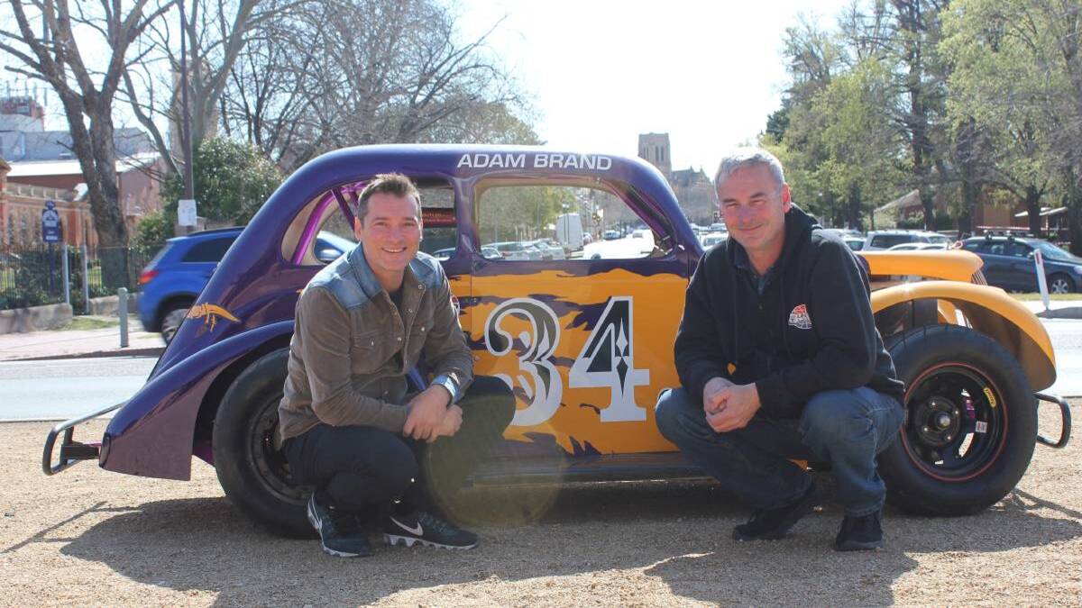 REVVING UP: Country singer Adam Brand and Legend Cars director John Dennehy. Photo: Mariam Koslay.