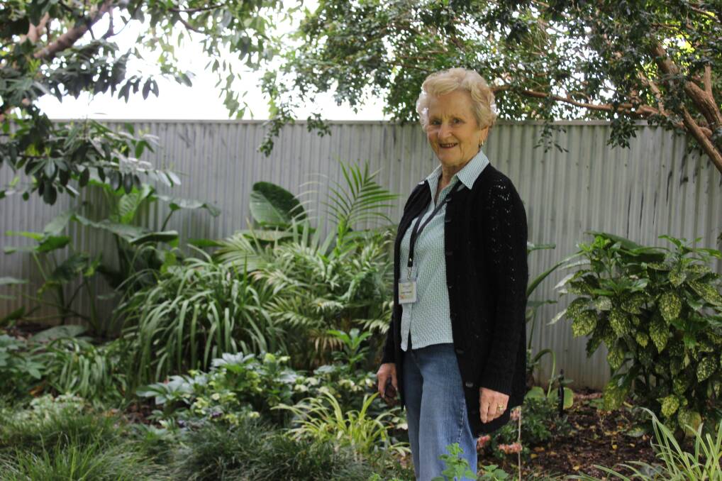 LUSH: Shirley admires the Sainty garden, which features cottage-style plantings of lavender and roses.