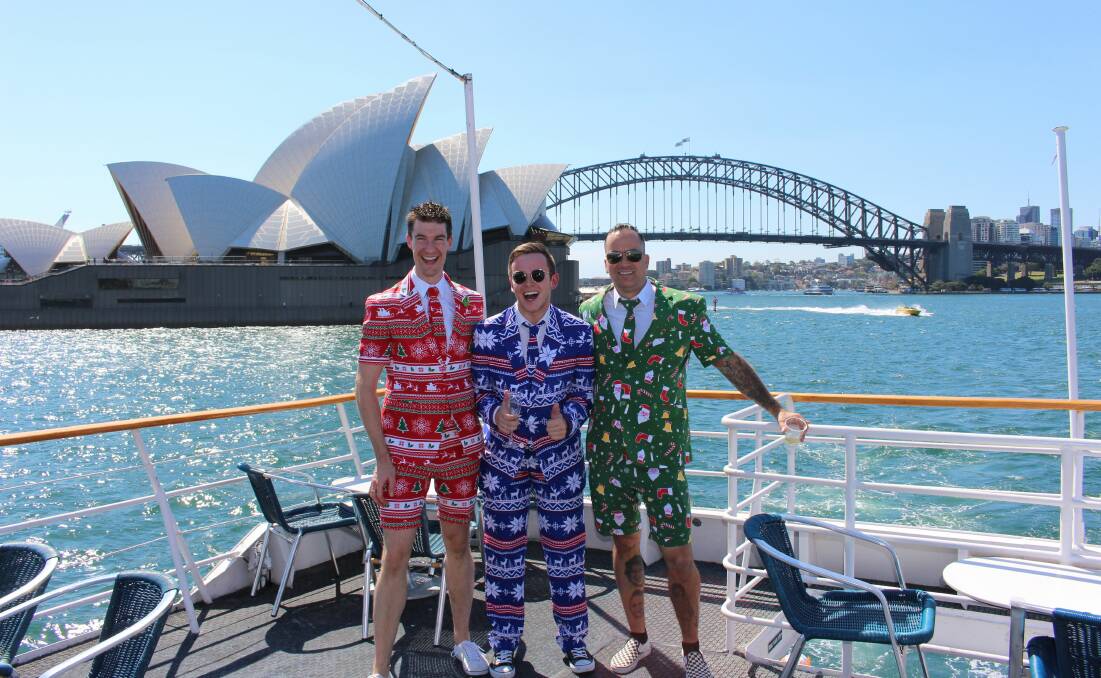 BEING HIMSELF: Jordan Hubbard (centre) finishing a long year in style at his Christmas Party. He is now a finalist in Mr Gay Pride Australia.