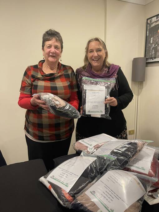 Soroptimist member Helen Morgan recently presented Deborah Sargeant, Goulburn Hospital emergency department social worker, with bags of clothing for domestic violence victims. Photo: supplied