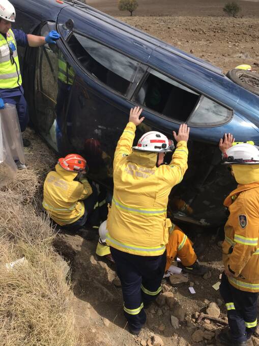 Southern Tablelands Zone Strike Team Echo 1 put their bodies on the line at the scene of an accident last year outside of Cooma. Photos: Lachlan Gilchrist