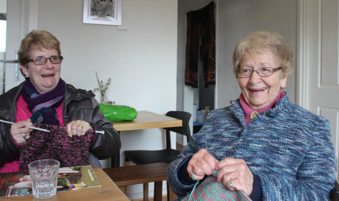 GOOD TIMES: Margaret McIntosh and Kath Heath enjoy a joke as they knit busily at the recent Friendship Club meeting.