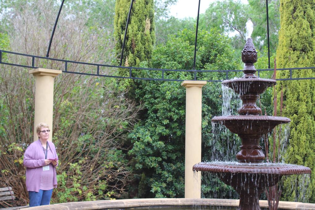 FOUNTAIN ENVY: Margaret McIntosh admires the magnificent water feature designed by Rena Mercuri.