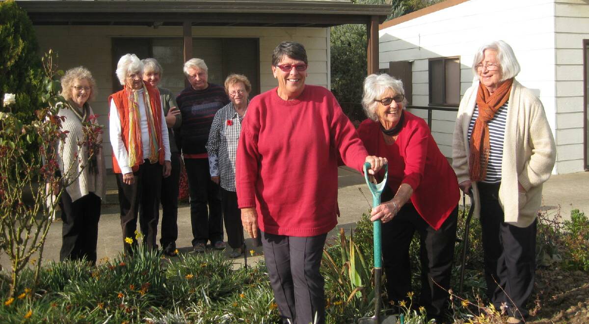 VALE: Gunning Garden Club members planting a native at the Tony Foley Centre in memory of Pauline Wicksteed. Names in story.
