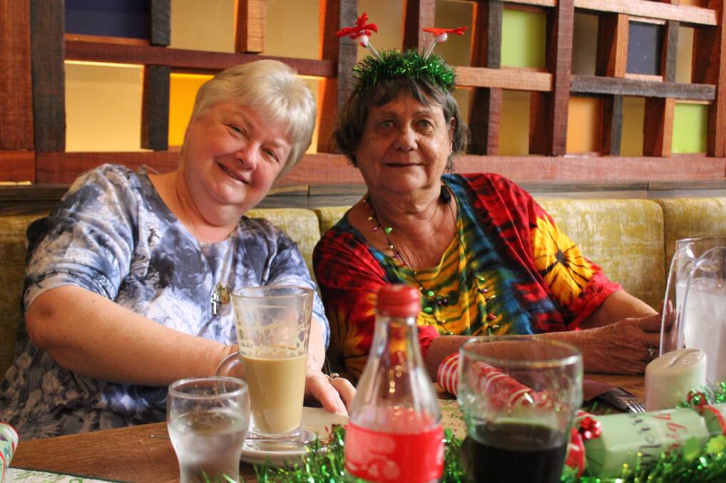 FUN TIME: Bernie Wright and Margaret Balfour had a blast when the MeetUp group met at the Soldiers Club for their Christmas Lunch.