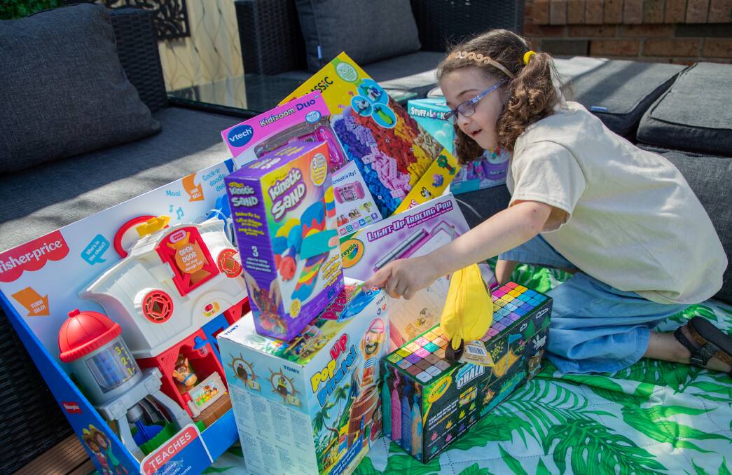 Madilyn explores the toy selection sent by Amazon. Photo: supplied 