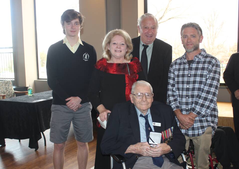 Four generations: Among those honoured by the Governor General today was WWII veteran Ron Butterworth, pictured with family members Tristan, Jenny, Roger and Ashley Pollard. Photo: Burney Wong. 