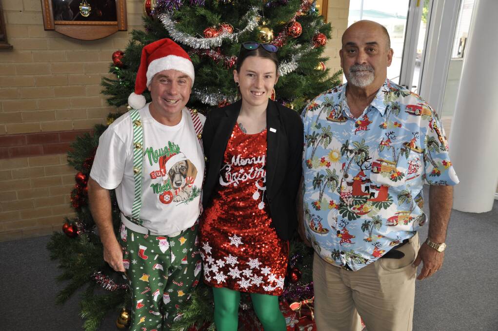 CELEBRATIONS: Crs Andrew Banfield, Leah Ferrara and Deputy Mayor Peter Walker geared up for a festive final meeting on Tuesday night. Photo: Louise Thrower
