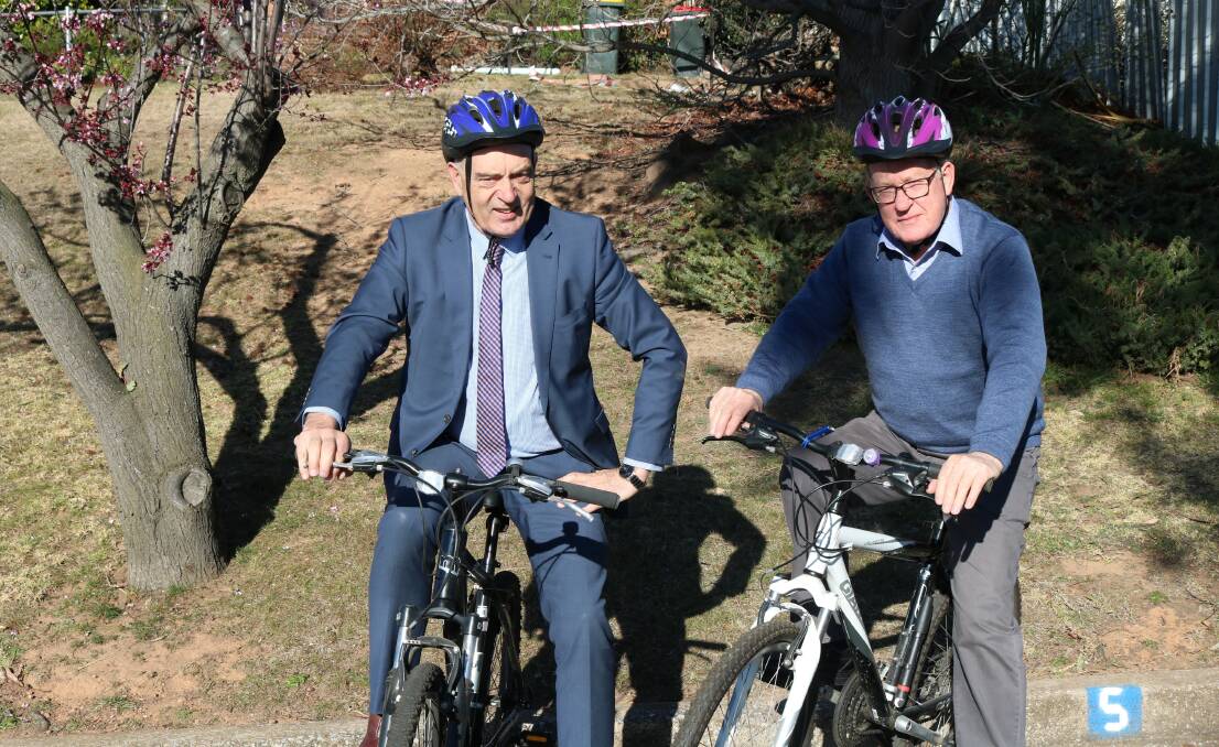WHEEL FUN: Goulburn Mulwaree Council general manager Warwick Bennett and mayor Cr Bob Kirk get ready for the community bike ride, scheduled for the October long weekend.