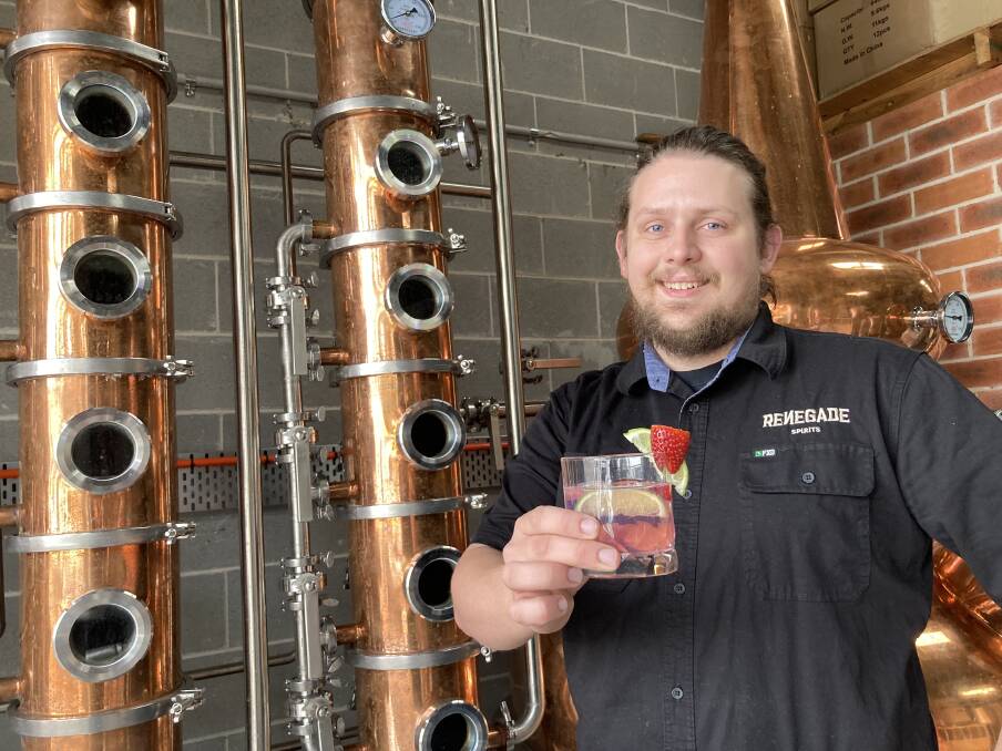 Renegade Spirits head distiller Jacob Newman with a glass of his strawberry, gumleaf and blood fingerlime gin (and a dash of tonic). Photo: Michelle Haines Thomas
