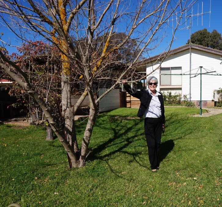 CAUTIOUSLY KEEN: Real estate agents like Angella Storrier (above, outside a house she is showing this weekend) are ready to open the door to public showings again - but don't forget to use the hand sanitiser.