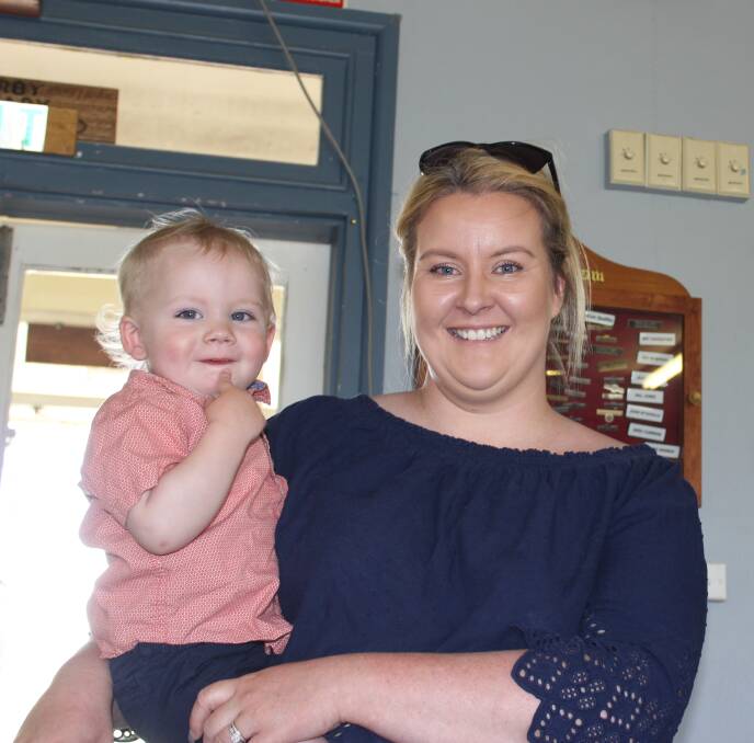 EXCITING: Laura Whybrow with her son, William, waiting on the Calcutta Draw at the Sports Club on Saturday..