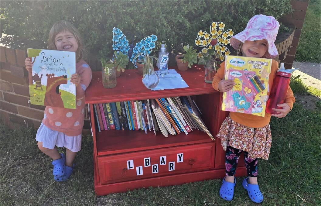 Little River, 3, and Max, 4, De Ath were delighted when their street library - mistaken as hard rubbish left out for free - was returned. Photo: supplied