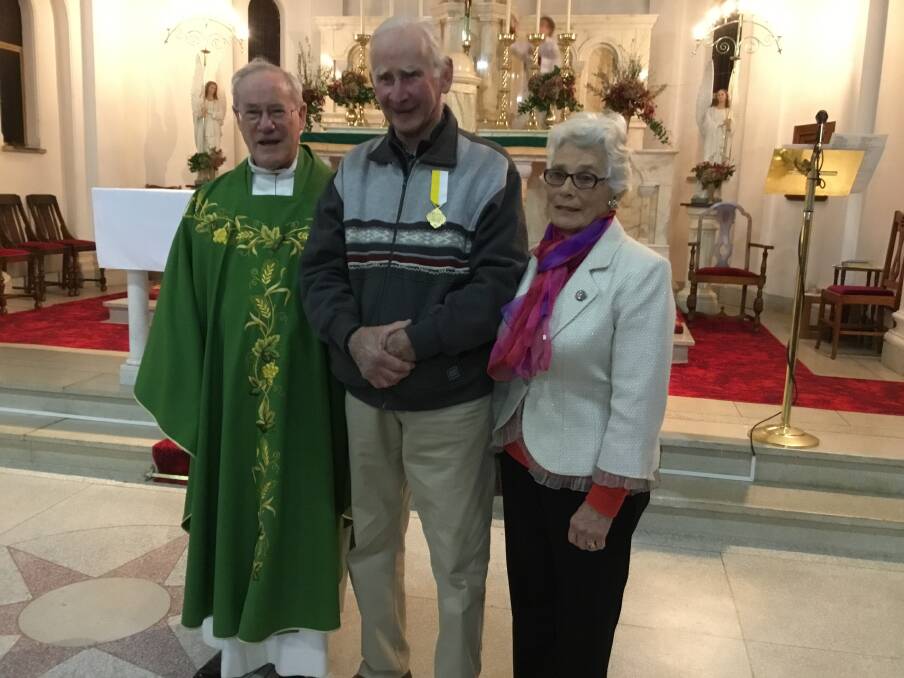 HONOUR: Pat Keough (centre) with Fr. McDermott and Margaret McGregor on the occasion of his Papal Award presentation.