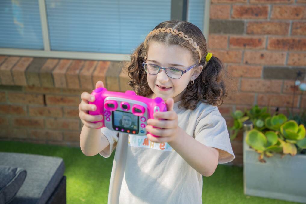 Madilyn checks out the VTech Kidizoom camera. Photo: supplied