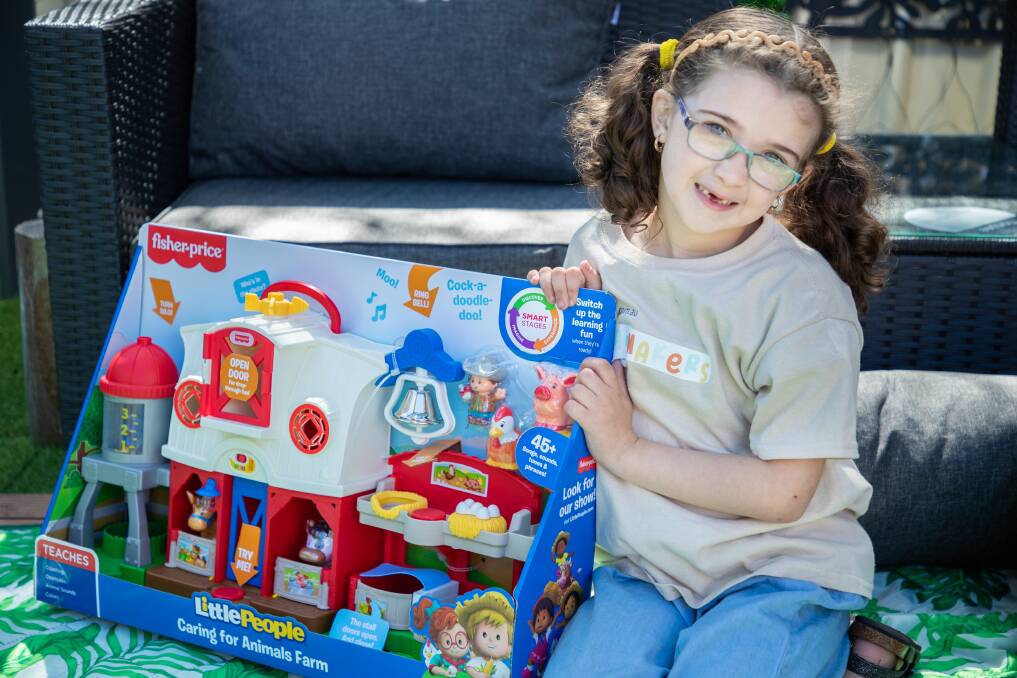 Madilyn Chapman with her pick of Amazon's top 100 toys of 2020. Photo: supplied 