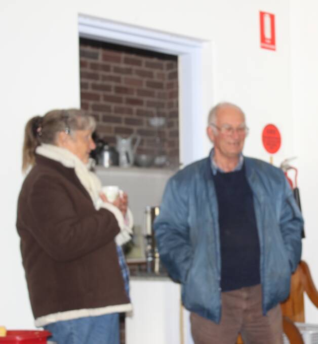 MAKING PLANS: Roslyn and her friend Ray Sheils at the August meeting of the Taralga Historical Society. Photo: supplied.