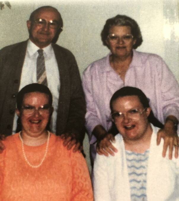 Bronwyn Cooper (in blue) with her twin sister Julieanne and parents Sid and Lorna. Photo: supplied.