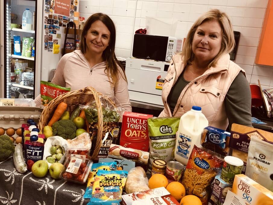 Paula Zrilic and Tracey Watkins will now operate Our Community Pantry from an area outside the Australian Wool Handlers building on Saturday afternoons.