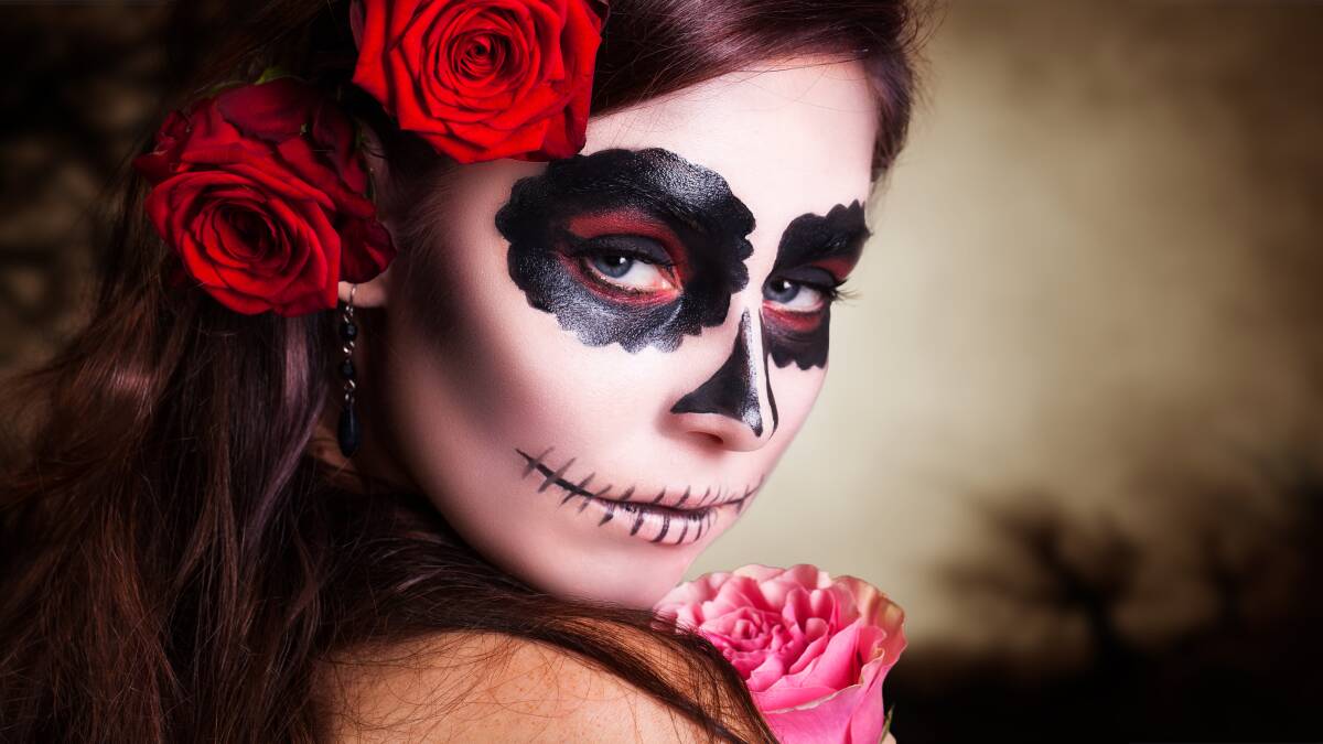 All you need for a sugar skull costume is some face paint and some flowers. Picture: Shutterstock