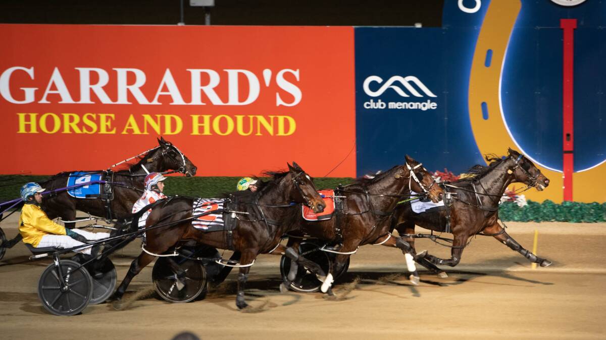 Top form: Hewitt and Send It cross the finish line on Saturday night in the Regional Championships State Final at Menangle. Photo: Harness Racing NSW. 