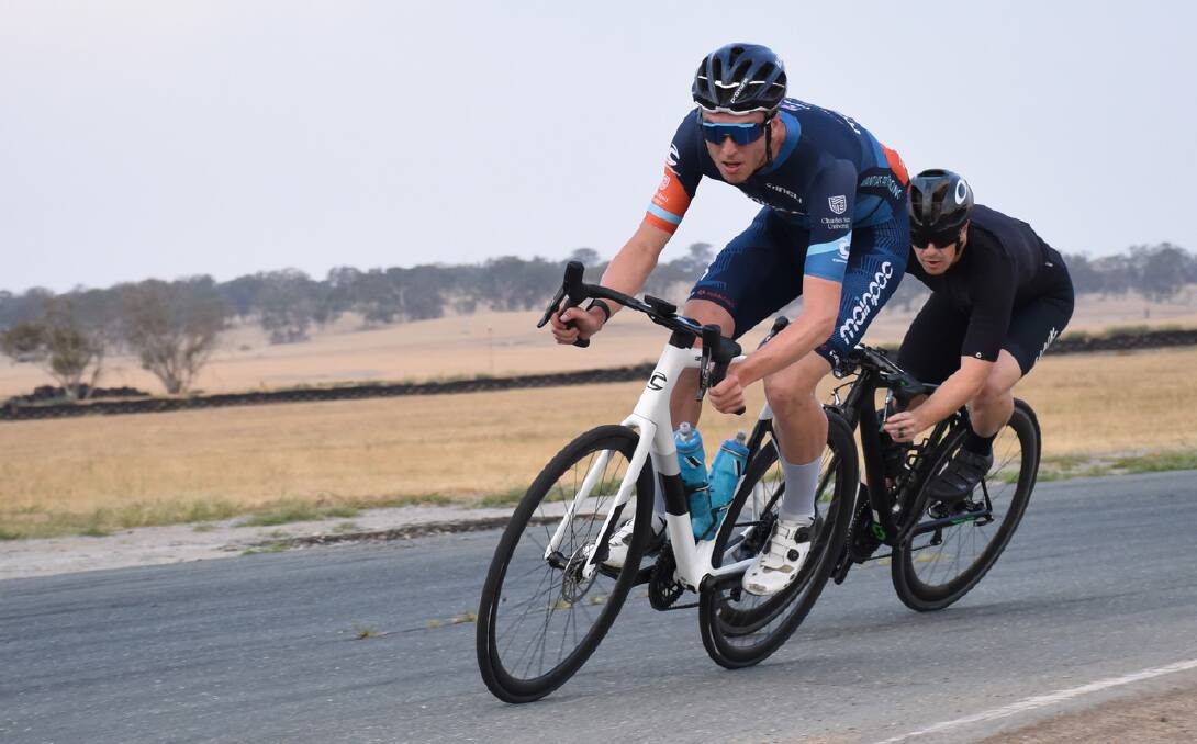 On the bend: A Grade's Jacob Emmerton and Jason McLaughlin battle it out during the Goulburn Cycle Club's Wakefield Park meet last week. Photo: David Carmichael.