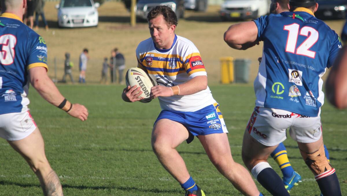 Sidestep: Mitchell Atkinson swerves to avoid Tuggeranong defenders as he aims for the tryline on Sunday, where the Bulldogs would go down 20-24 against the Bushrangers. Photo: Zac Lowe. 