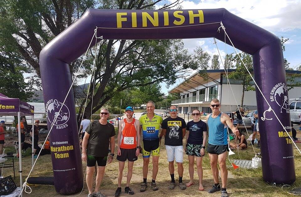 Finish line: Fifth Place outright, "Giant 440 Woodys #4 Pete", made up of (from left) Andy Dawes, Stefan Hess, Rodney McWhirter, Mick Beard, Jacqui Oberg and Andy Oberg. Missing are Rod Smith and Nathan Frazer. Photo: supplied.