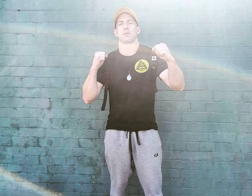 Guard up: Darcy Sullivan poses ahead of his Sanda bout last weekend, and he will once again fight this weekend at the Ainslie Football Club in Canberra. Photo: Darcy Sullivan/Facebook. 