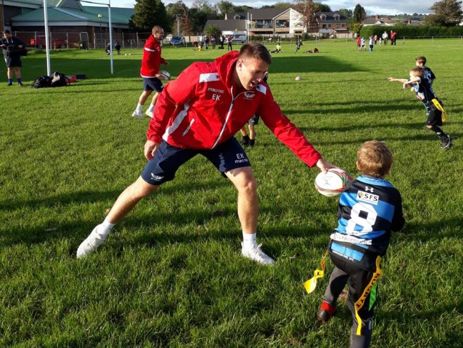 Inspiring: Ed Kennedy, seen here during a school visit as a member of the Scarlets, said his time in Wales spurred significant personal and professional growth. Photo: Scarlets Community Foundation.
