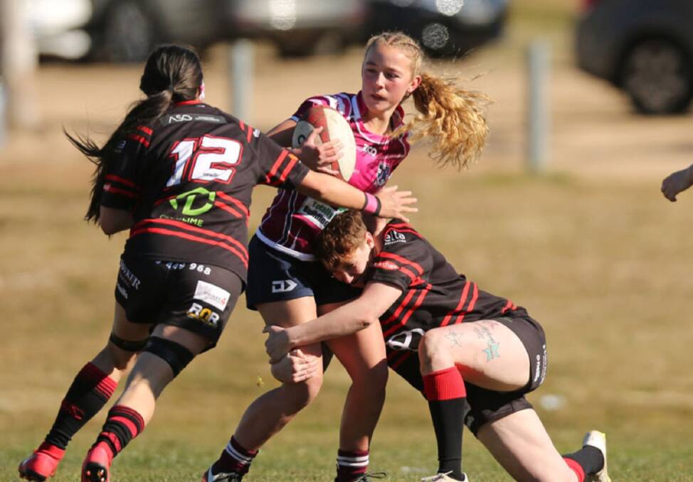 Tackled: Chloe Waddell playing for the Dirty Reds women during the 2019 season, where her speed and technical prowess stood out. Photo: Pete Oliver. 