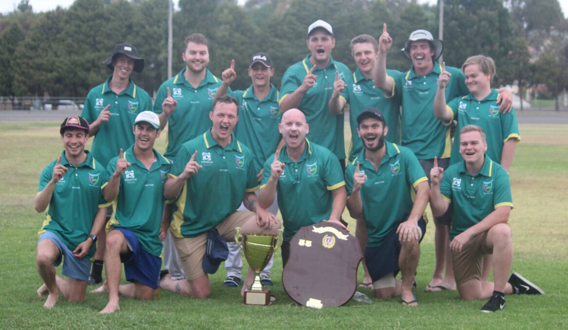 Winners: Hibo Green celebrate their grand final victory over the Workers Stags on Saturday at Seiffert Oval. Photo: Zac Lowe.