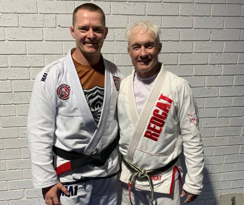 Promoted: Craig Harmer (left) with John Will shortly after being awarded his blackbelt recently. Photo: Goulburn Martial Arts Academy. 