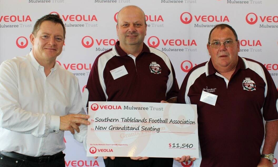 Welcome boost: Craig Norris (centre) said the STFA was very grateful for the Veolia Mulwaree Trust's decision to provide its latest project with additional funding. Photo: STFA Football.