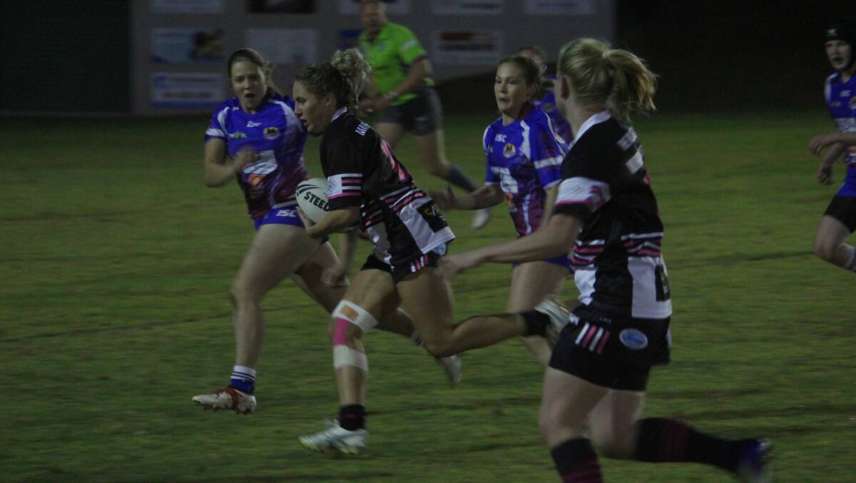 Break free: Jess Howard makes a run for the tryline during Friday night's clash between the Magpies and the Stockmen. 